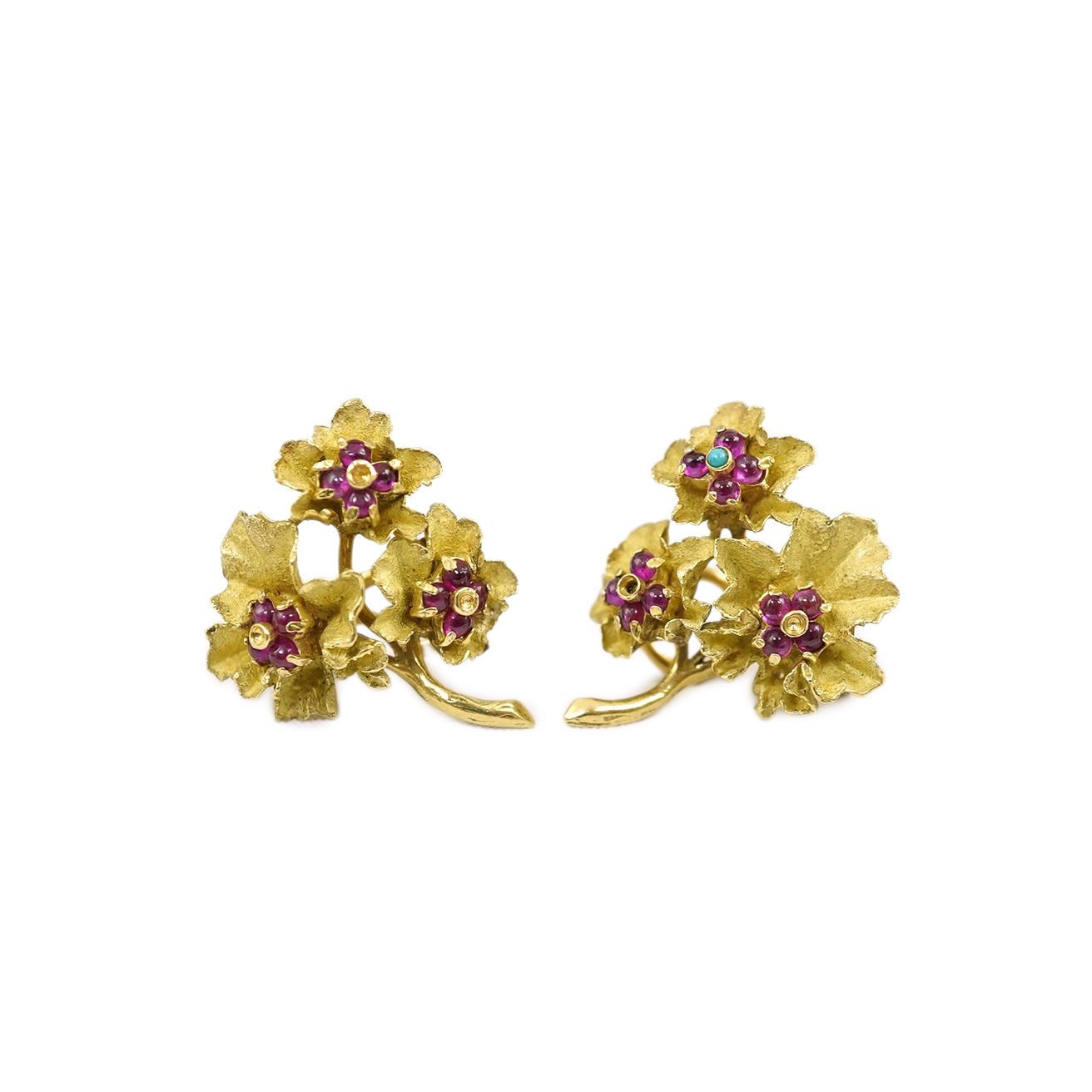 A pair of 1970's 18ct gold cabochon ruby, turquoise and cluster set ear clips, retailed by Liberty & Co, (one stamped Liberty), gifted by the actor Peter Sellars to his daughter Sarah